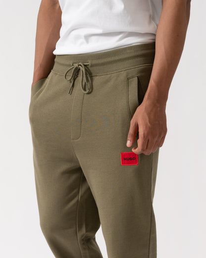 Close up of HUGO Doak212 Mens Joggers - Open Green 389