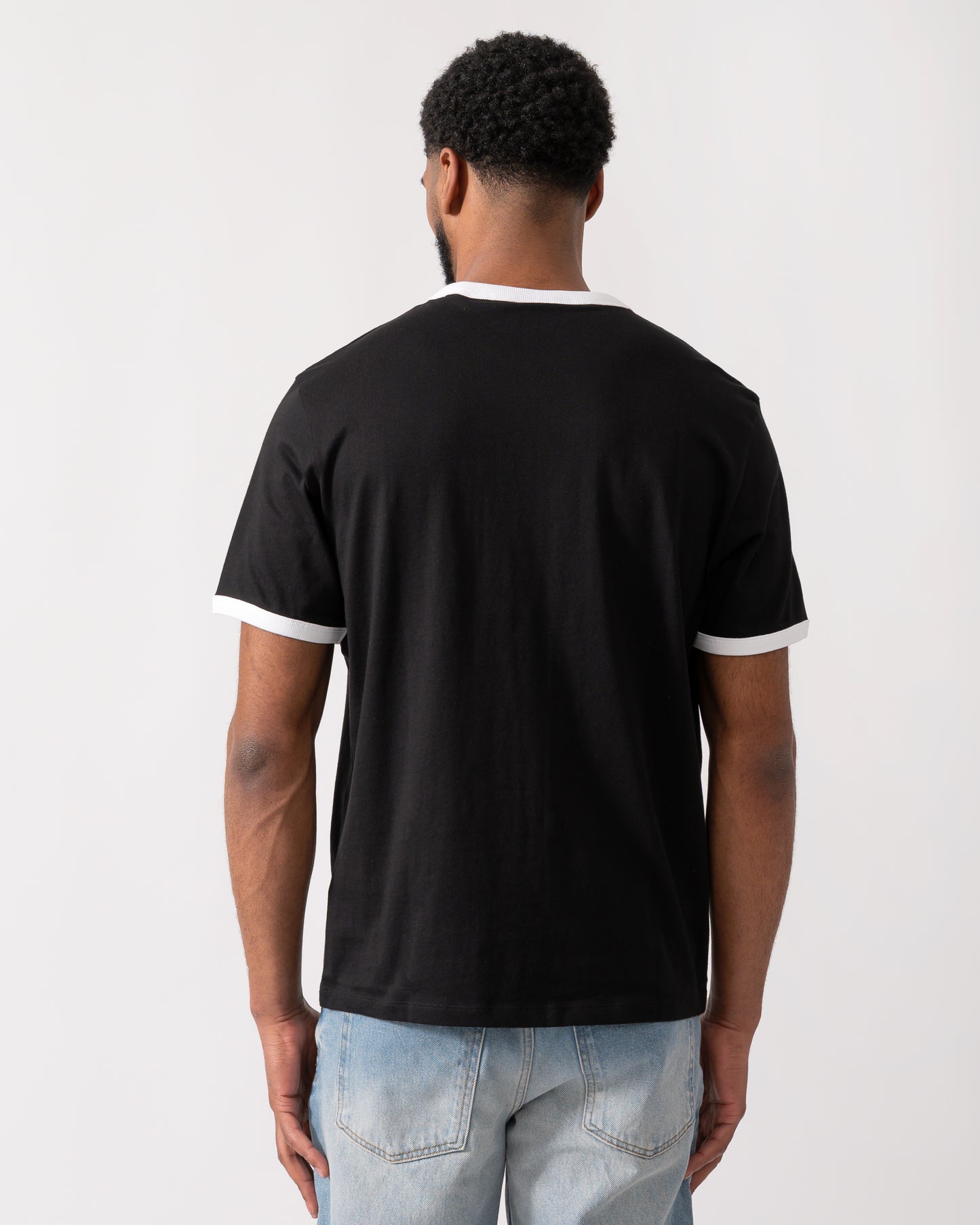 back of a model wearing a HUGO Doffice Mens T-Shirt in Black
