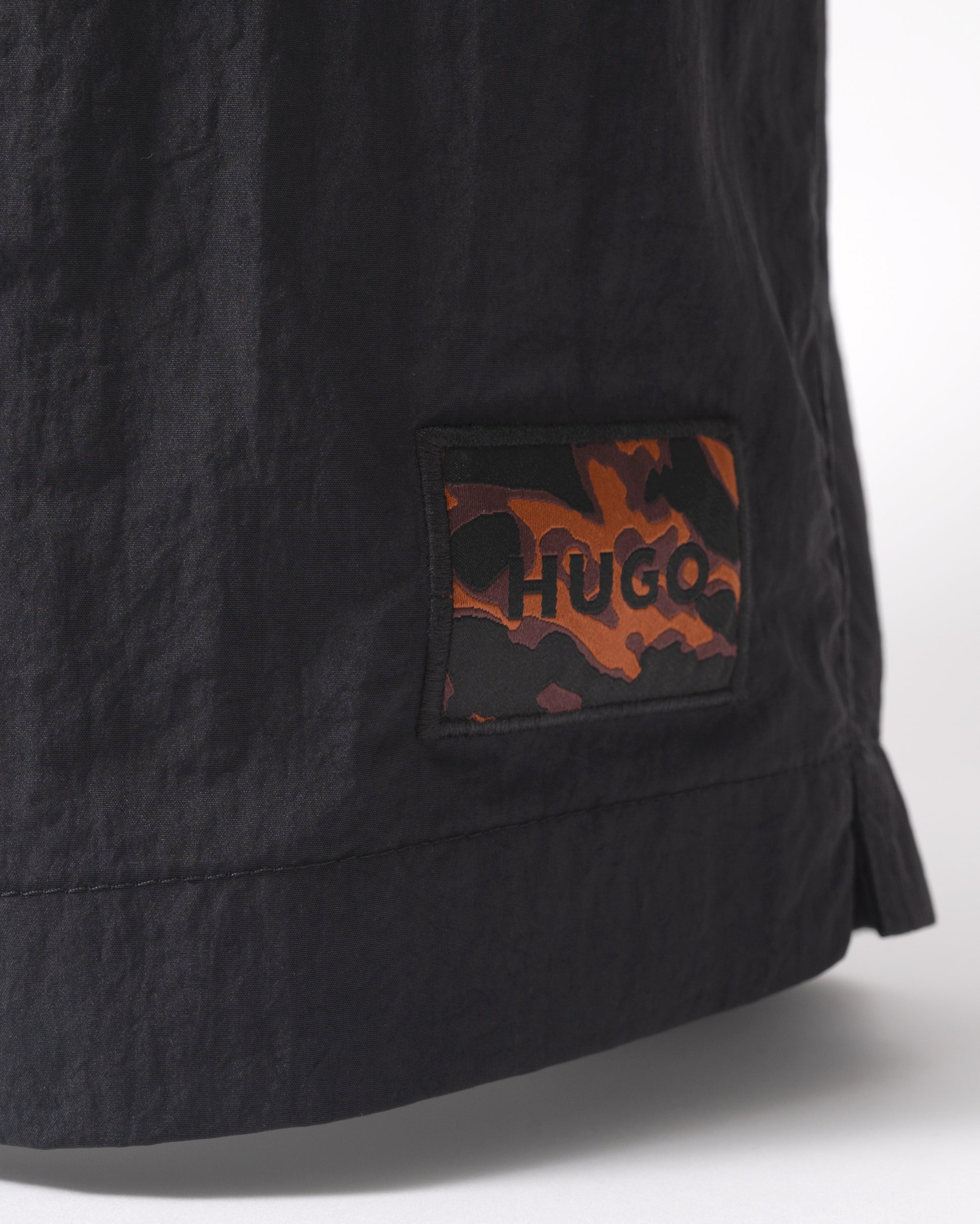 logo detail of HUGO Dominica Mens Quick-Drying Swim Shorts In Recycled Material With Logo in Black 004