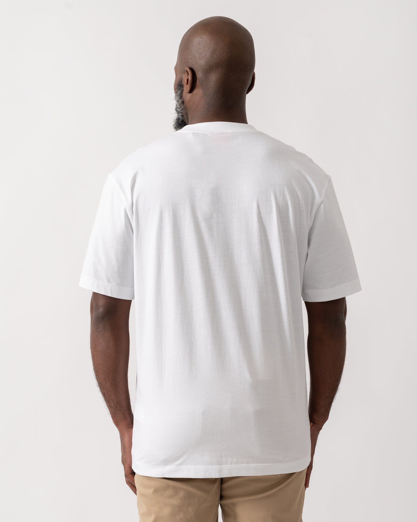back shot of a model wearing a HUGO Doreston Mens Graphic T-Shirt in White
