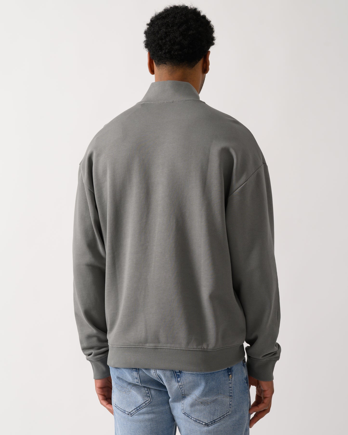 back shot of a model wearing a HUGO Durty244 Mens 1/4 Zip Sweatshirt in Dark Grey 025