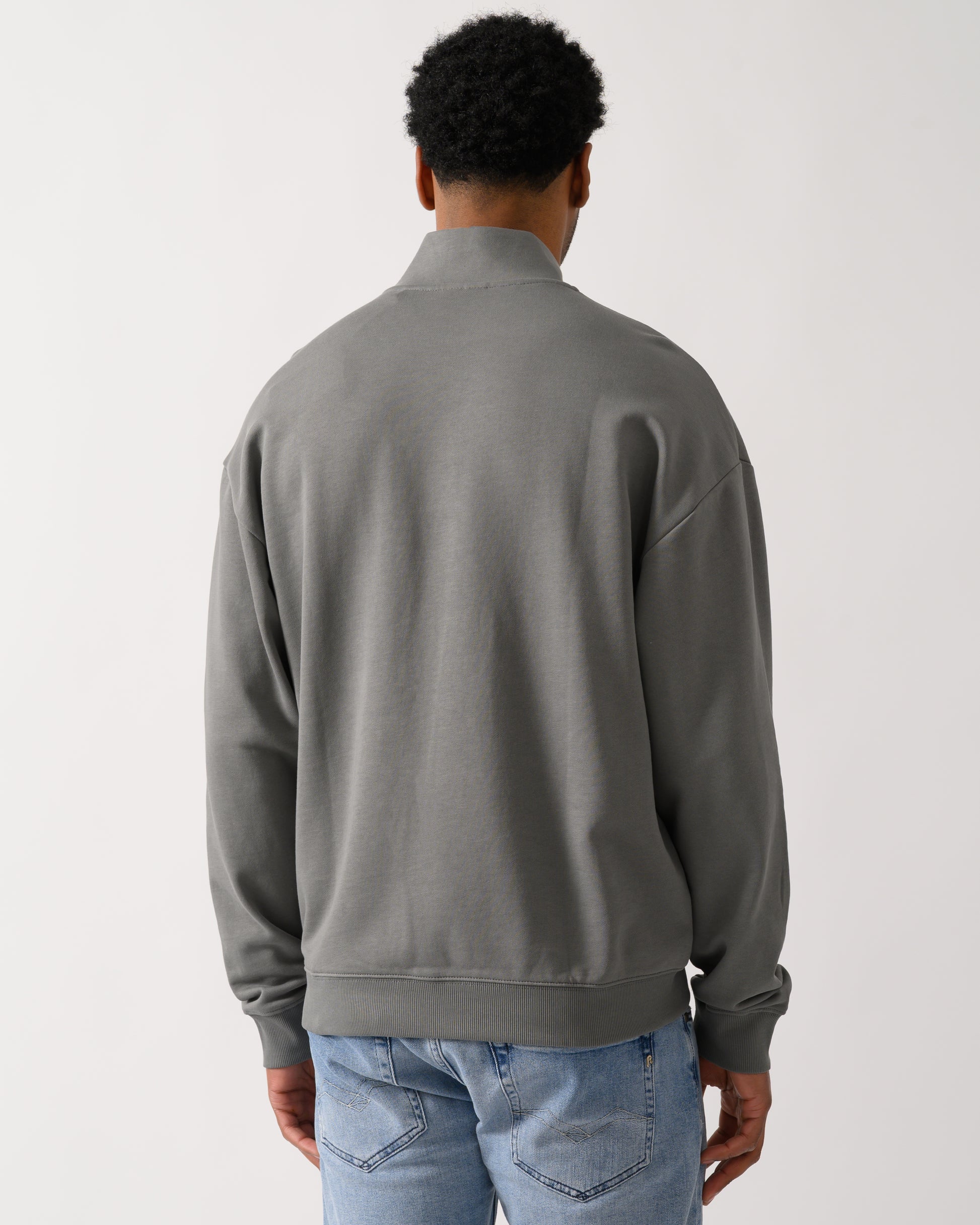 back shot of a model wearing a HUGO Durty244 Mens 1/4 Zip Sweatshirt in Dark Grey 025