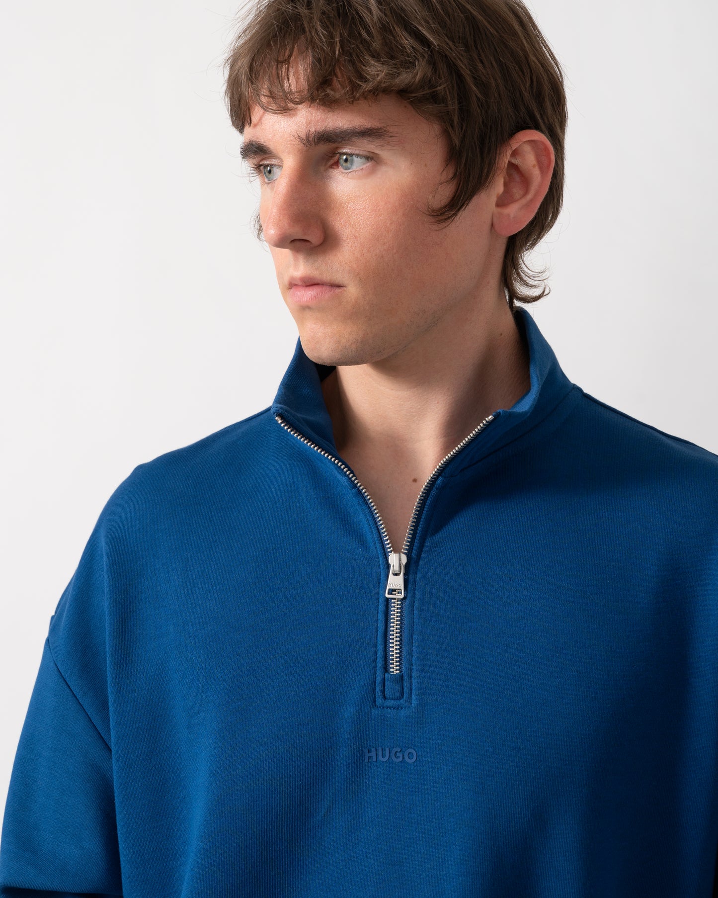 close up of a HUGO Durty244 Mens 1/4 Zip Sweatshirt in Open Blue 498