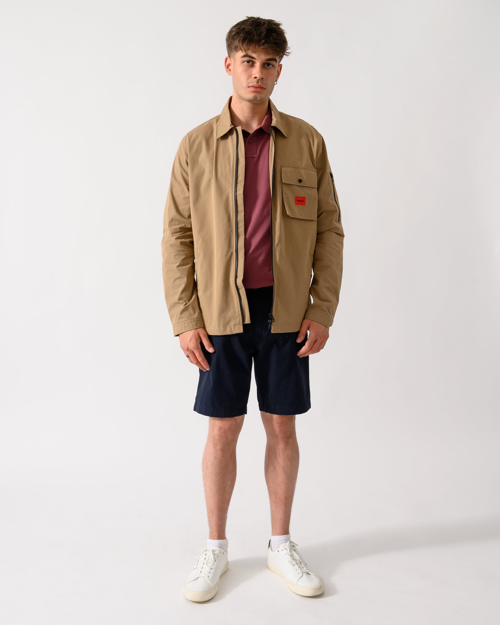 full length shot of a model wearing a HUGO Emmond Mens Zip Overshirt in Beige Overflow 928