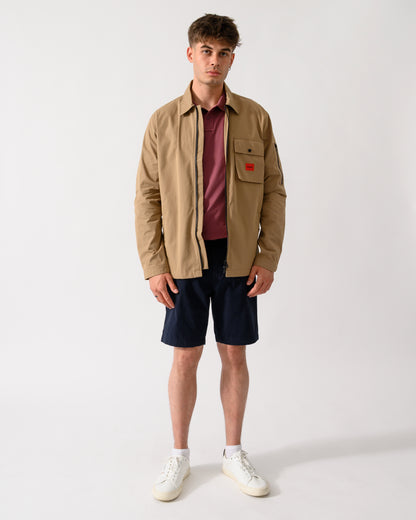 full length shot of a model wearing a HUGO Emmond Mens Zip Overshirt in Beige Overflow 928