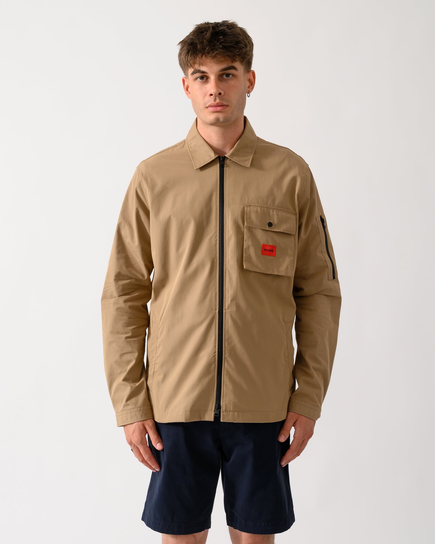 model wearing a HUGO Emmond Mens Zip Overshirt in Beige Overflow 928