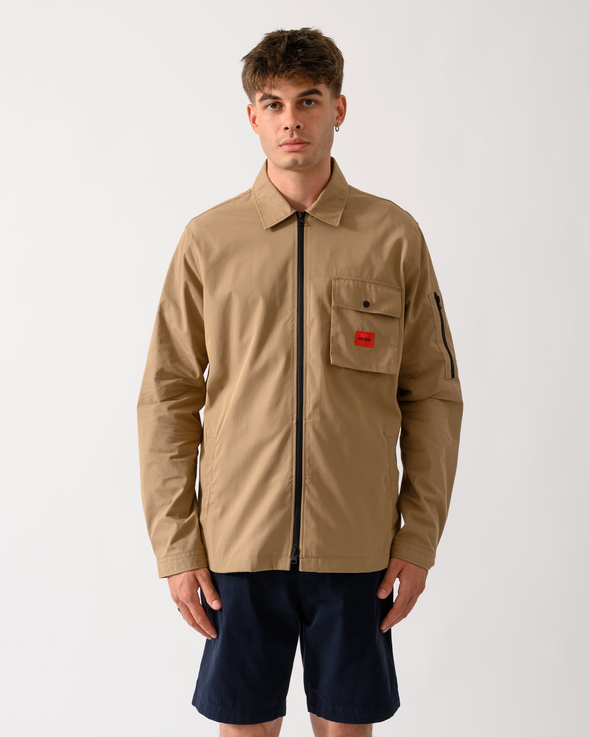 model wearing a HUGO Emmond Mens Zip Overshirt in Beige Overflow 928