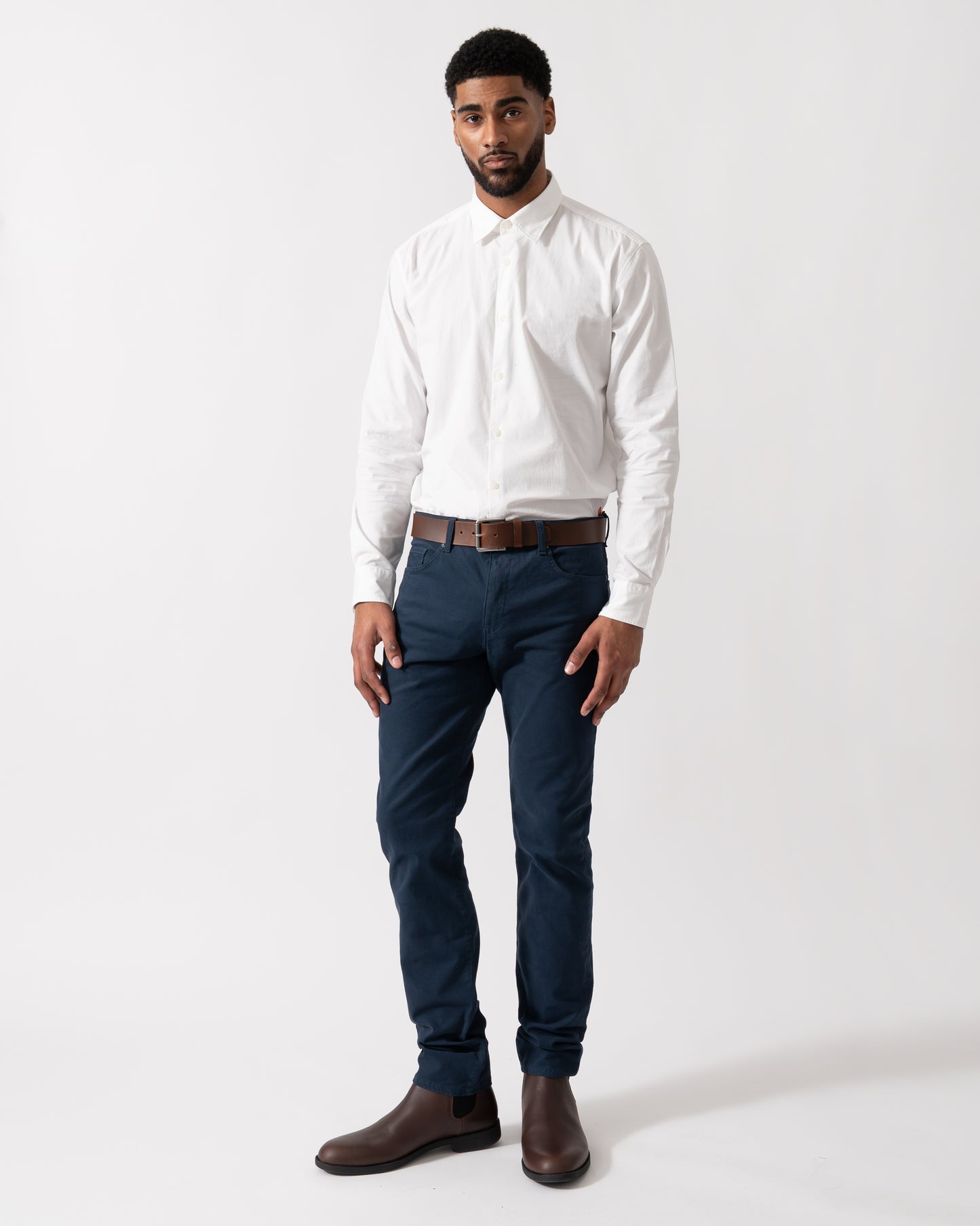 Full length shot of a Model wearing HUGO Ermo Mens Slim-Fit Shirt in Stretch-Cotton Canvas in Open White