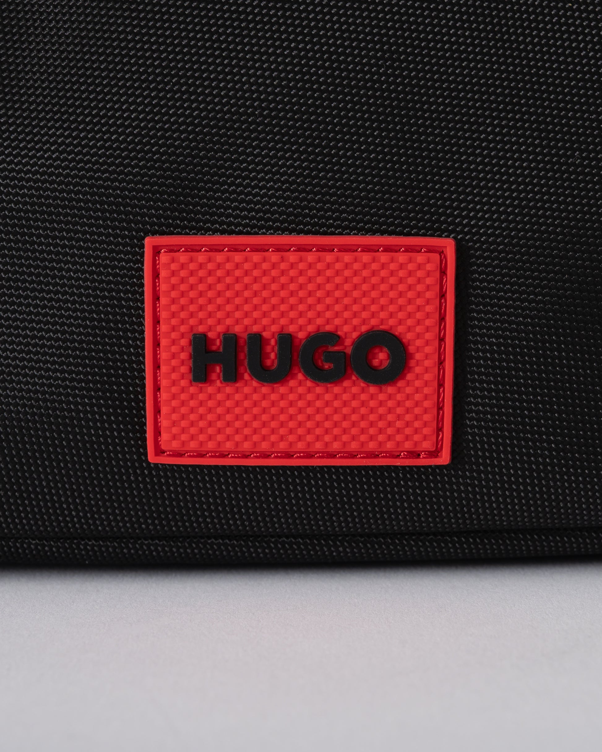 logo detail of a HUGO Ethon 3.0 Mens Crossbody Bag in Black