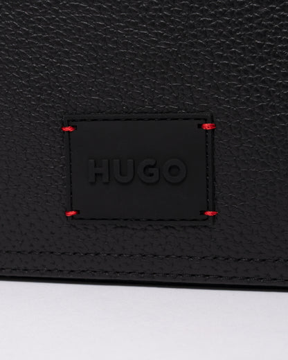 studio photograph showing the logo detail of a HUGO Ethon HI EVO Mens Washbag in Black 002
