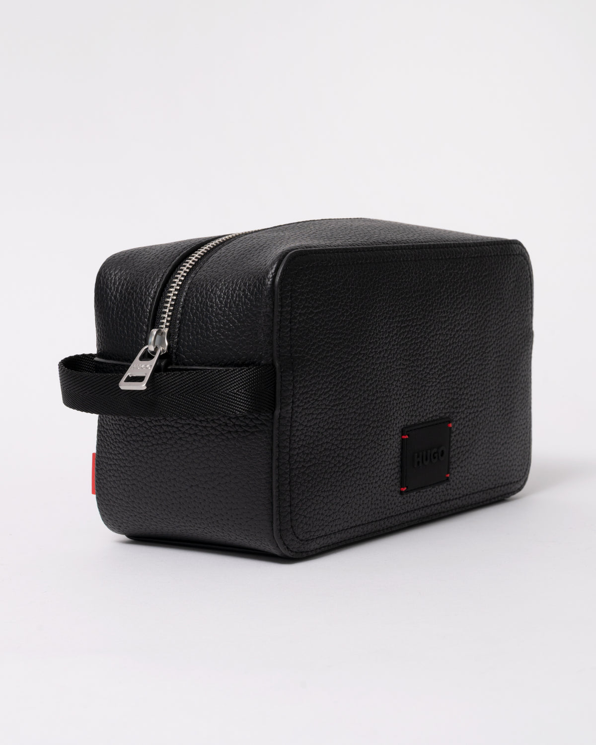 studio photograph showing the side of a HUGO Ethon HI EVO Mens Washbag in Black 002
