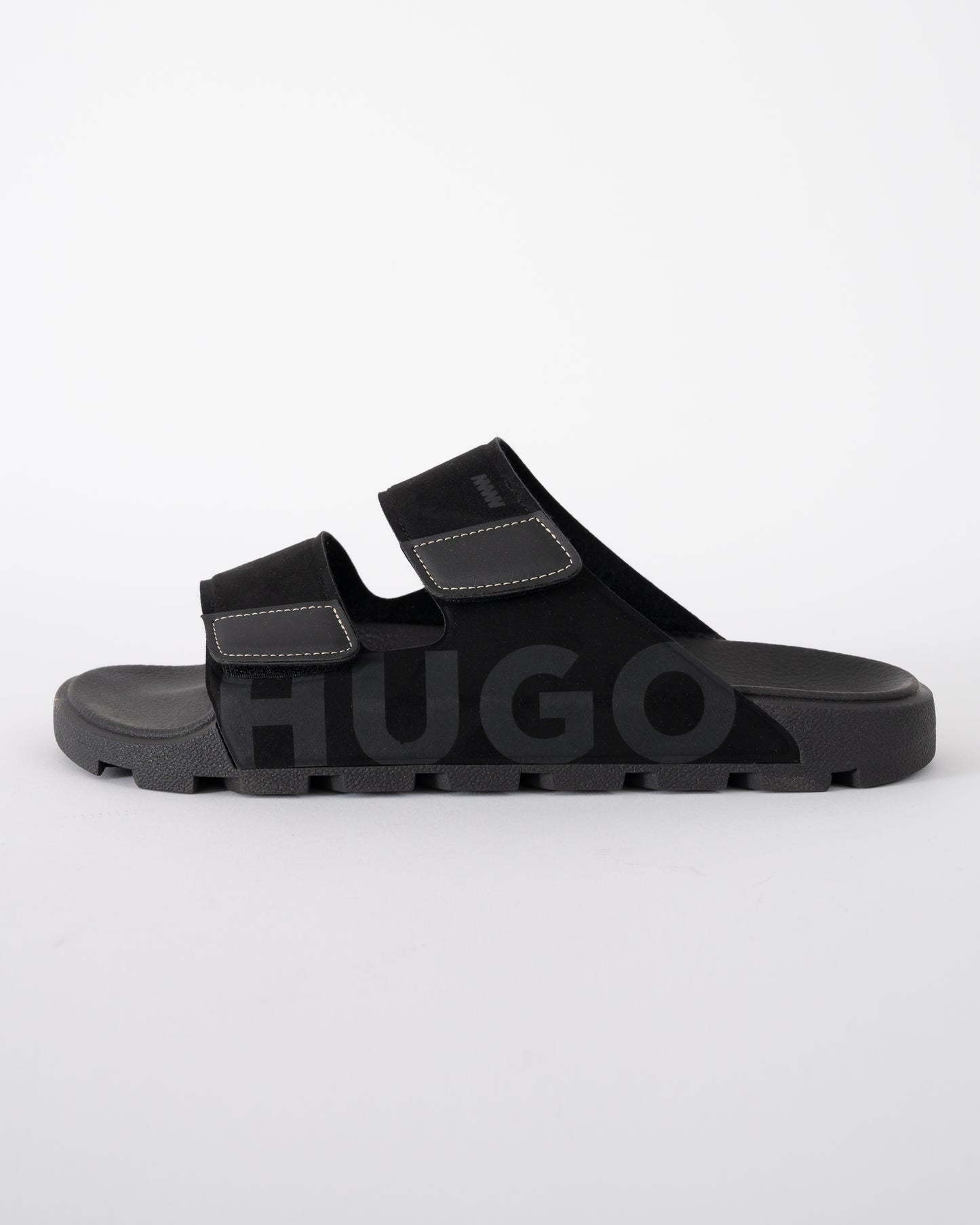 side shot of HUGO Evander Mens Faux-Suede lides with Logo Detailing in Black