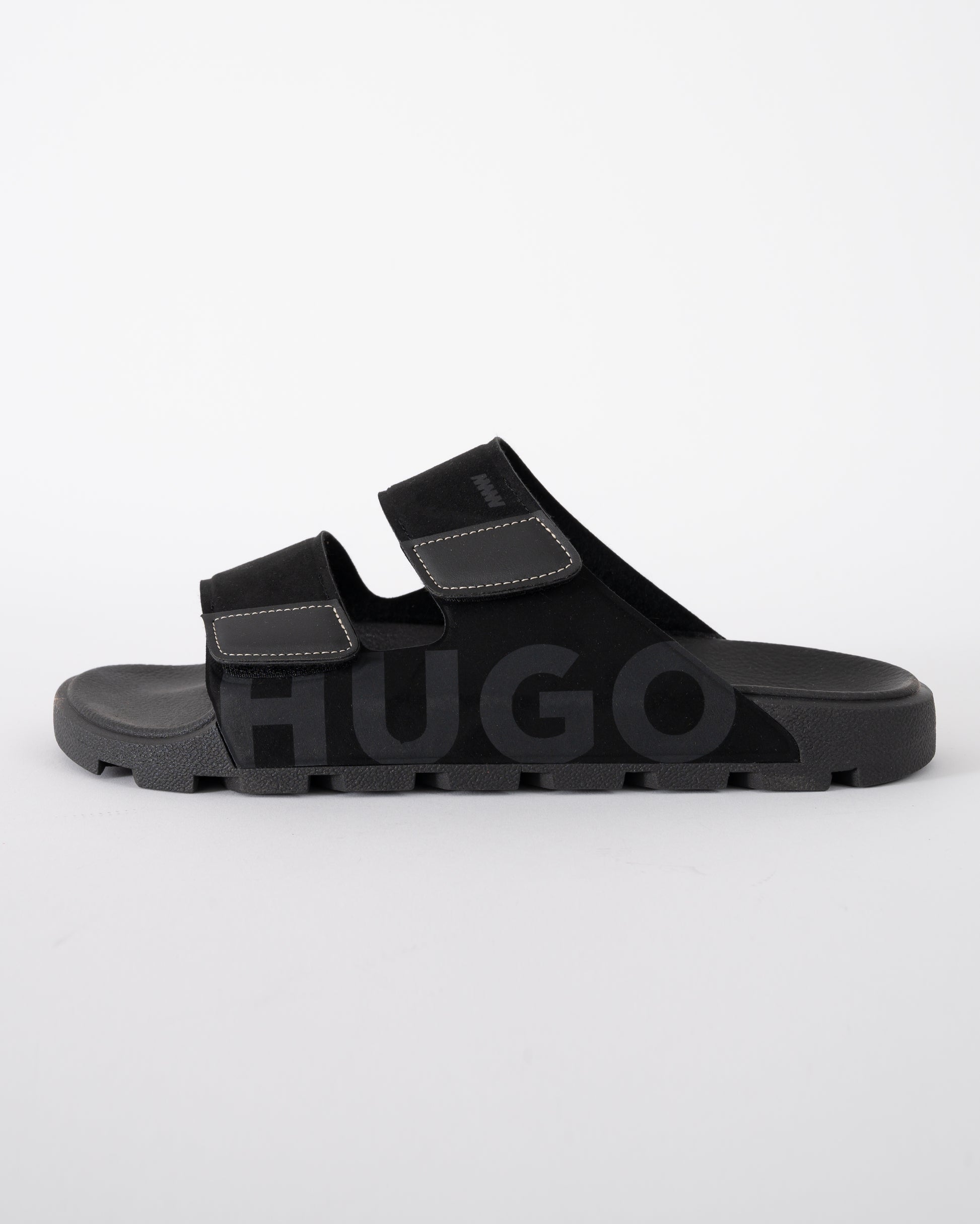 side shot of HUGO Evander Mens Faux-Suede lides with Logo Detailing in Black