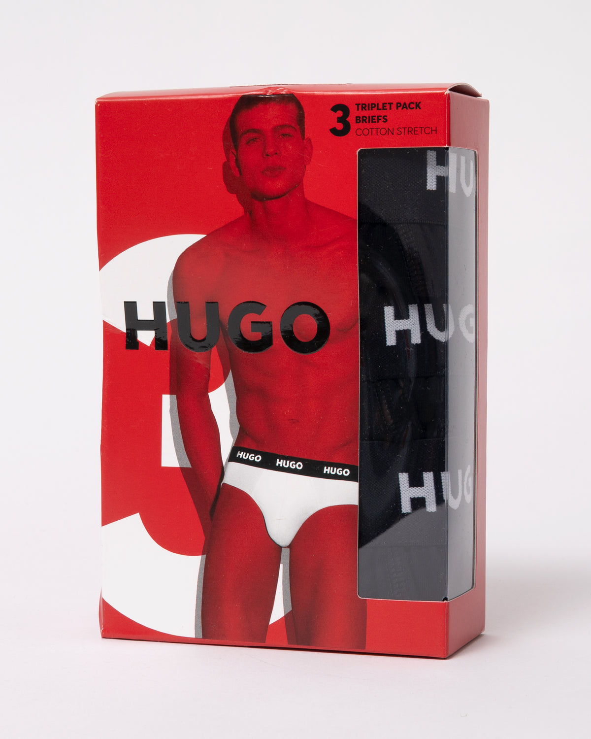 studio photograph showing outer packaging of HUGO Hipbrief Mens Three-Pack of logo-waistband briefs in stretch cotton in Black 001