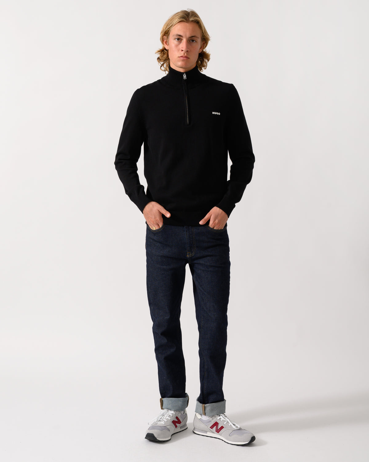 full length of a model wearing a HUGO San Quintus-C2 Mens 1/4 Zip Funnel Neck Jumper in Black 001
