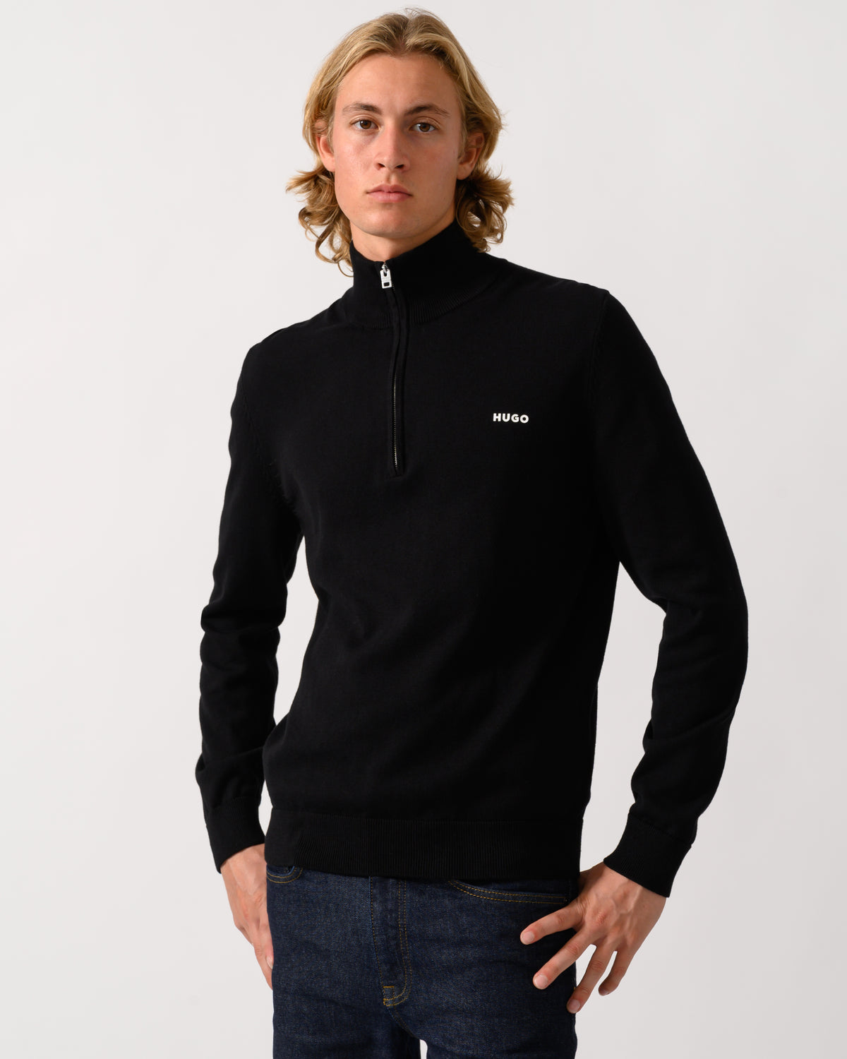 model wearing a HUGO San Quintus-C2 Mens 1/4 Zip Funnel Neck Jumper in Black 001
