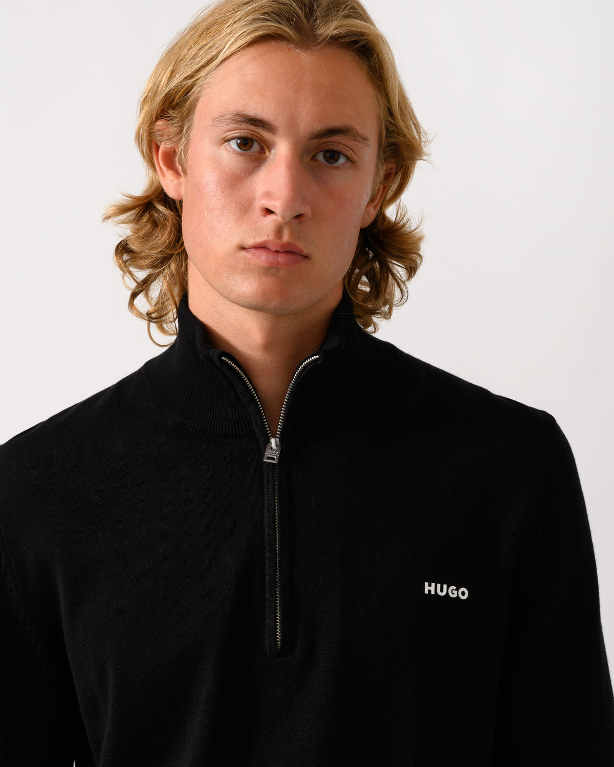 close up of a model wearing a HUGO San Quintus-C2 Mens 1/4 Zip Funnel Neck Jumper in Black 001