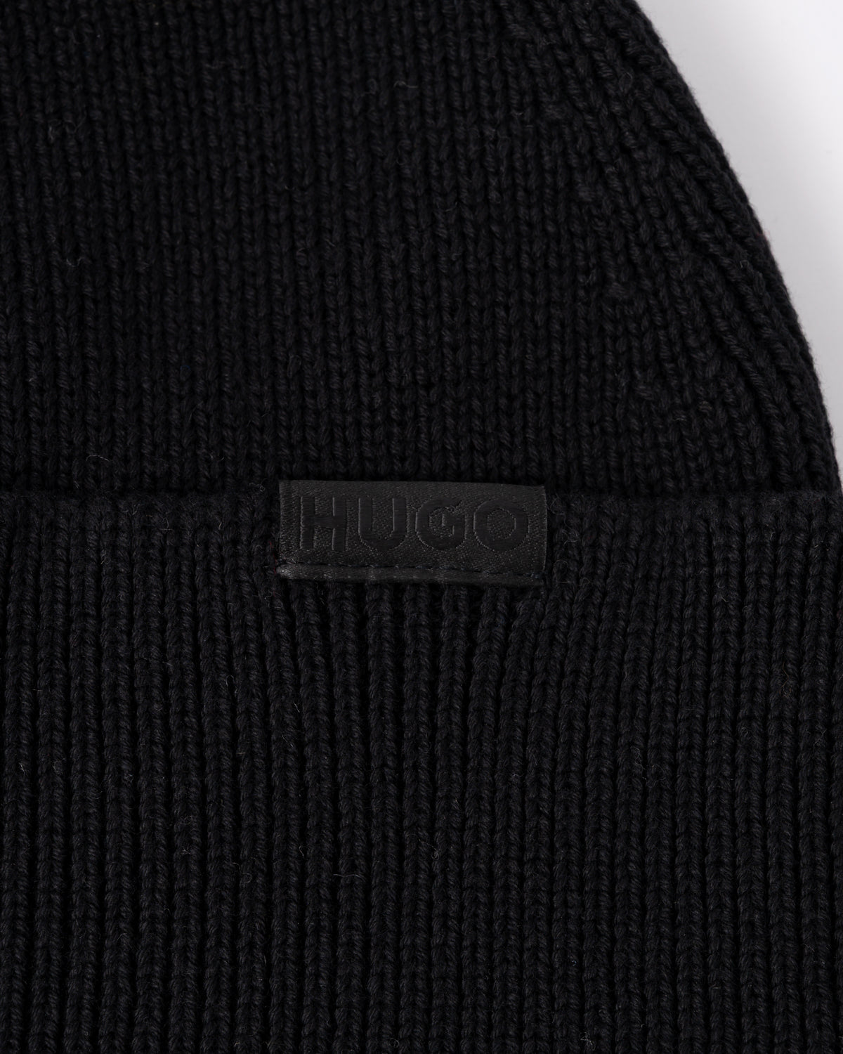 logo detail of a HUGO Xential Mens Beanie in Black 001