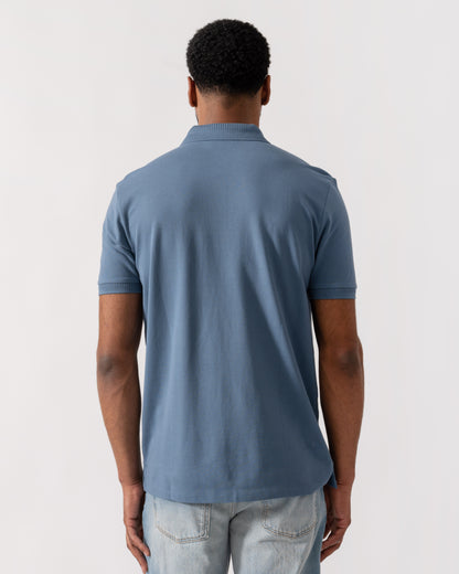 Model wearing HUGO Dereso222 Mens Cotton Piqué Slim-Fit Polo Shirt with Logo Label in Open Blue 496 - Back