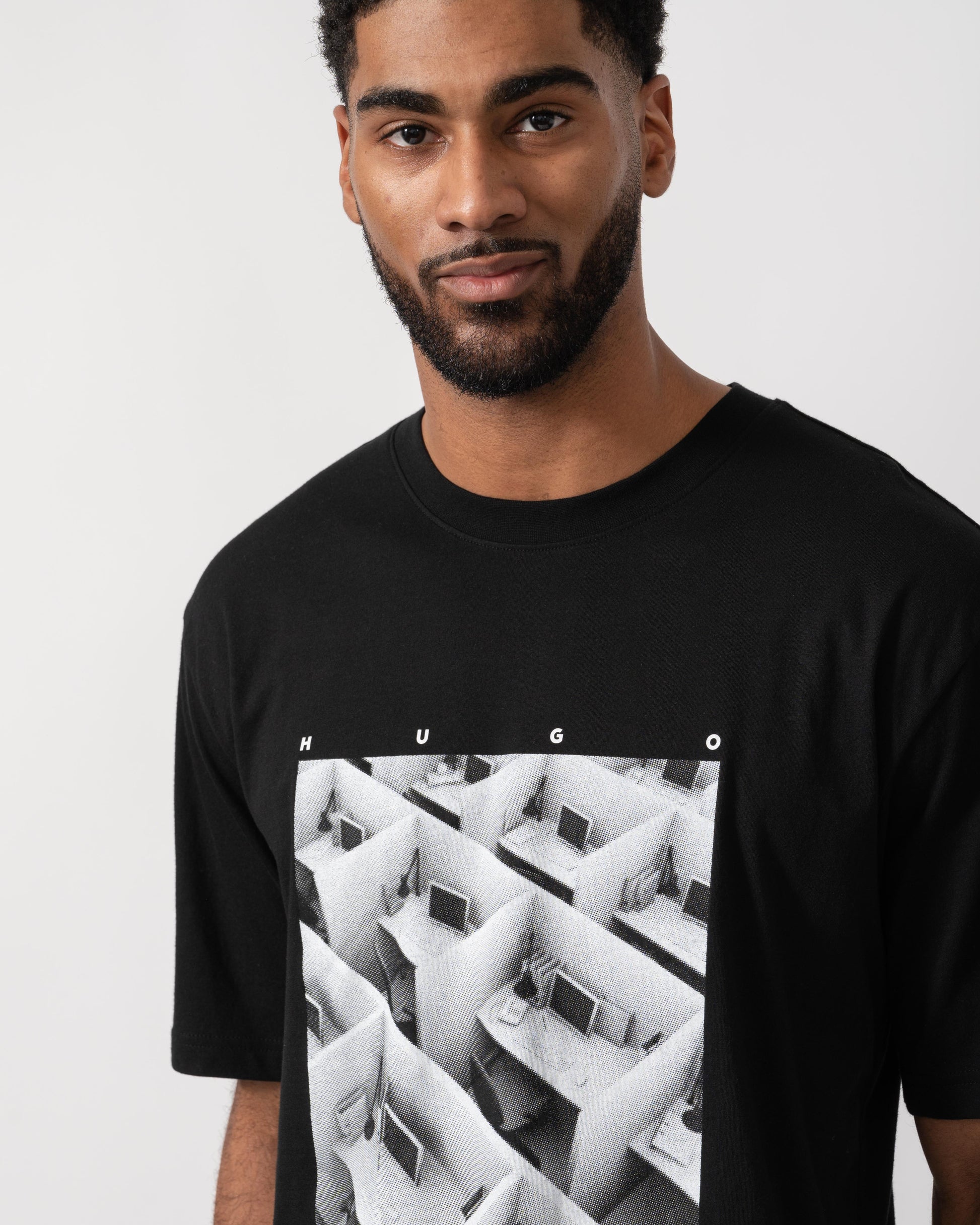 Model wearing HUGO Dodger Graphic T-Shirt in Black 001 - Detail