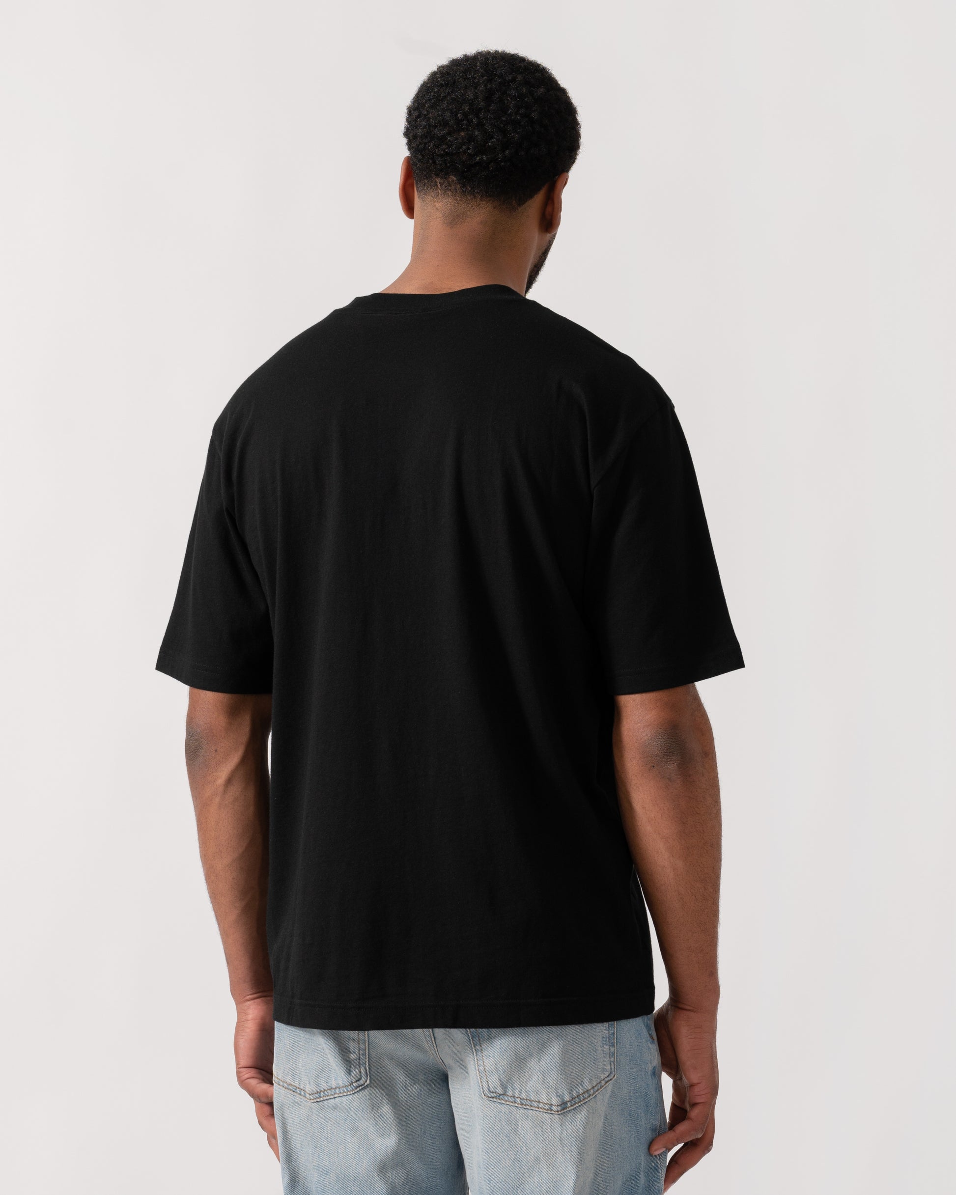 Model wearing HUGO Dodger Graphic T-Shirt in Black 001 -back