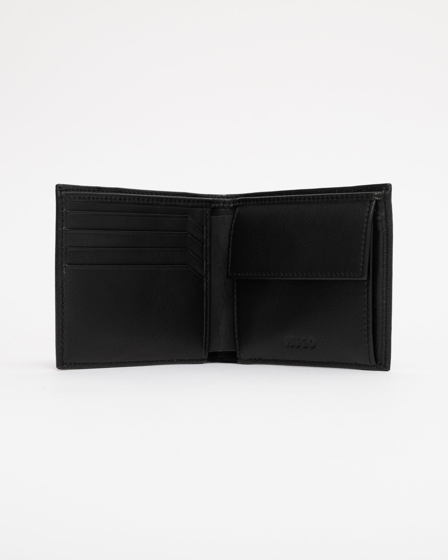 Black leather wallet open on a white background