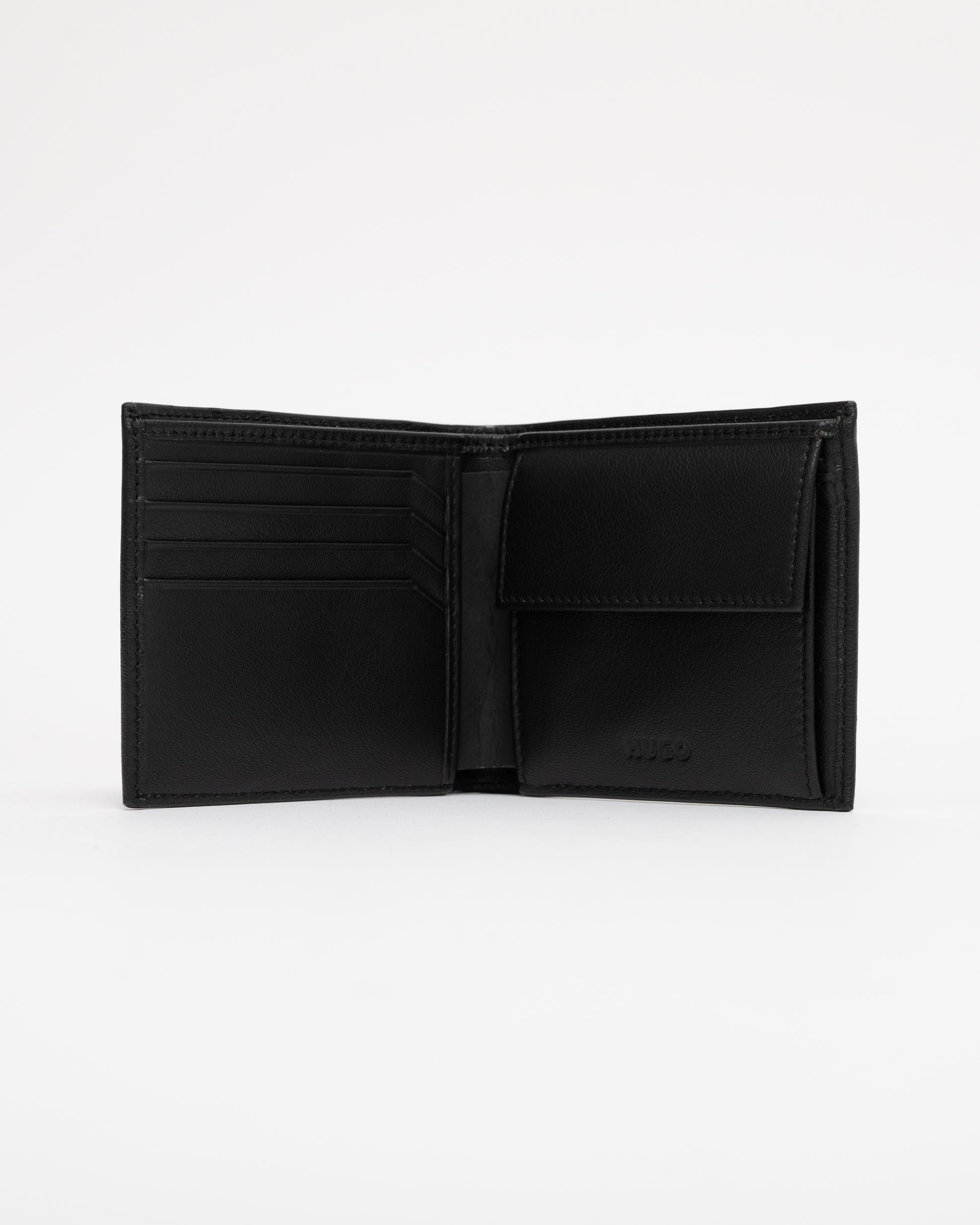 Black leather wallet open on a white background