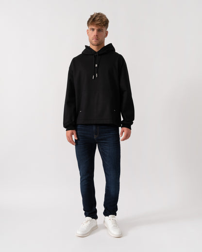 Model wearing HUGO Mens Dineo Mens Pullover Hoodie in Black 001 - Full Length