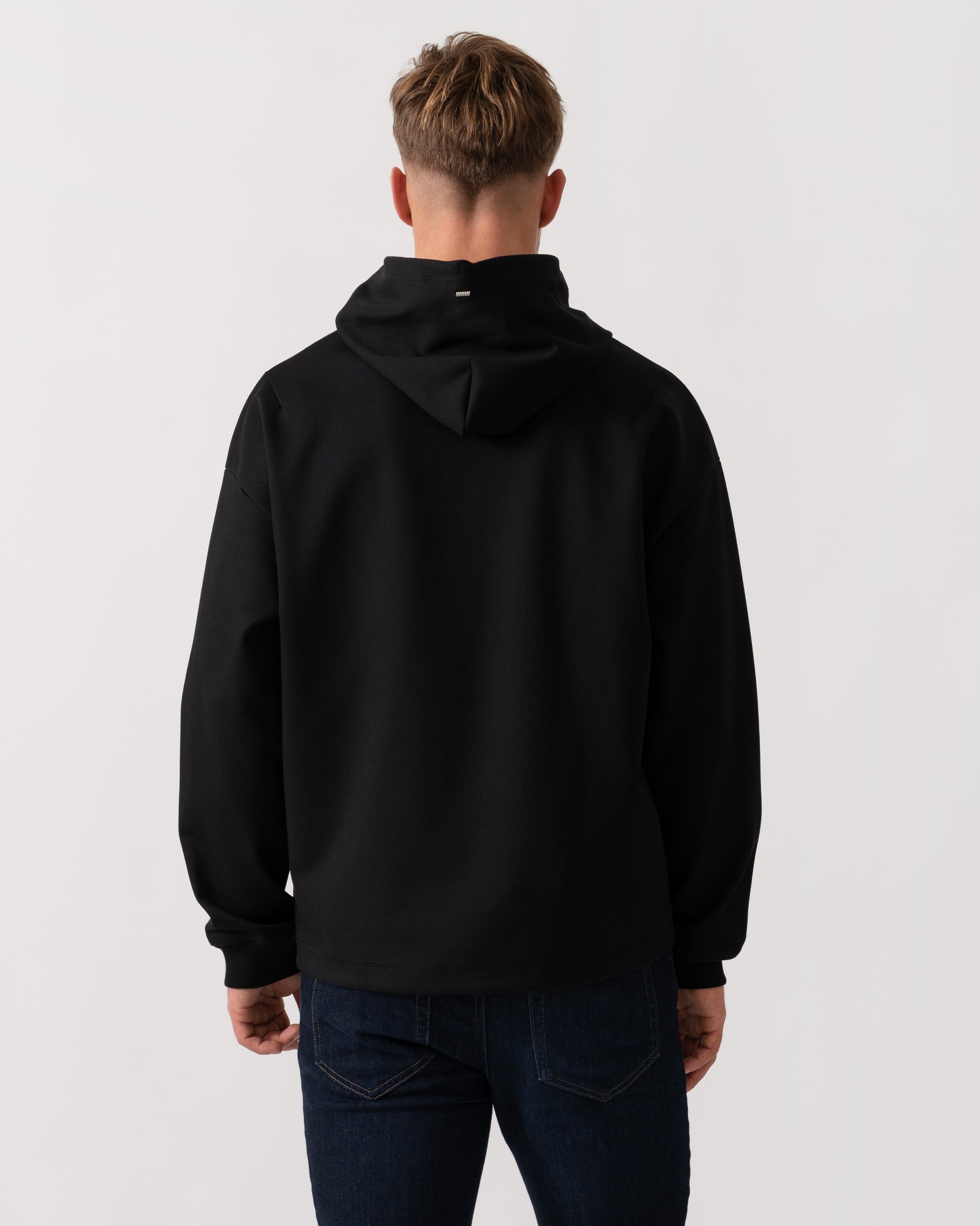 Model wearing HUGO Mens Dineo Mens Pullover Hoodie in Black 001 - Back