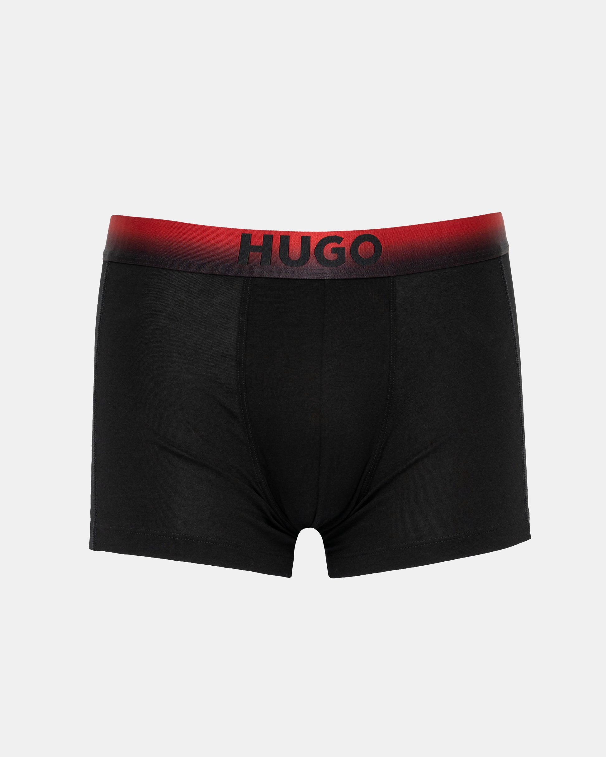 Black boxer briefs with red waistband featuring 'HUGO' brand on a light gray background