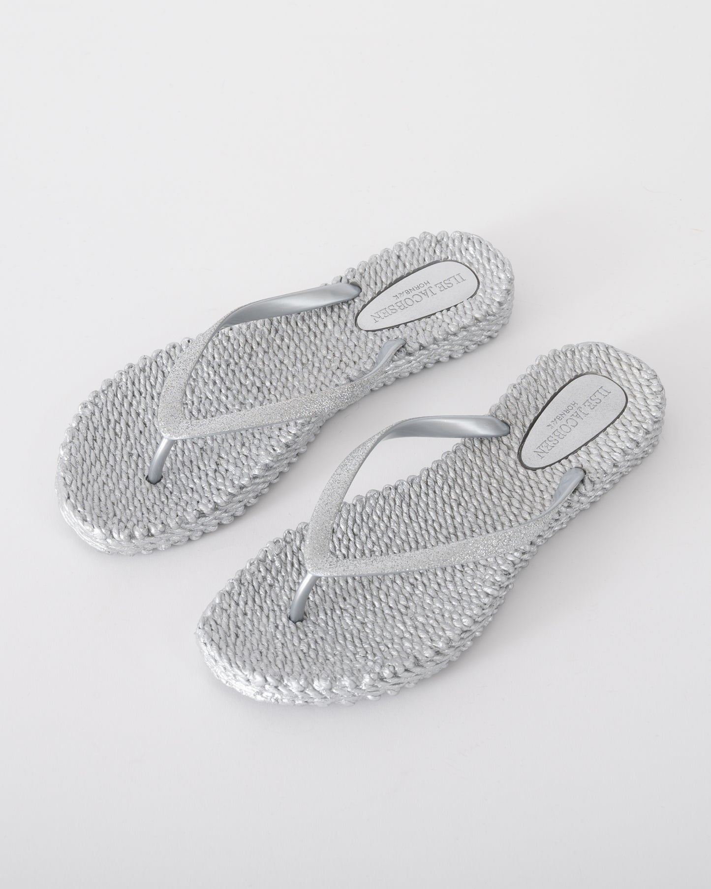 Studio shot of Ilse Jacobsen Cheerful Glitter Womens Flip Flops in Silver