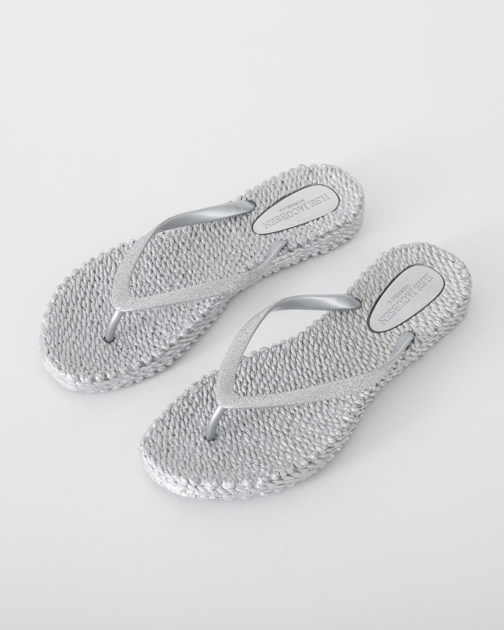 Studio shot of Ilse Jacobsen Cheerful Glitter Womens Flip Flops in Silver