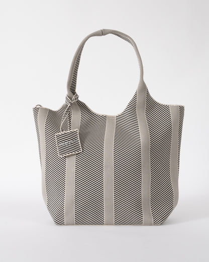 Studio shot of Ilse Jacobsen Knitty Womens Knitted Bag in Milk Creme and  Black