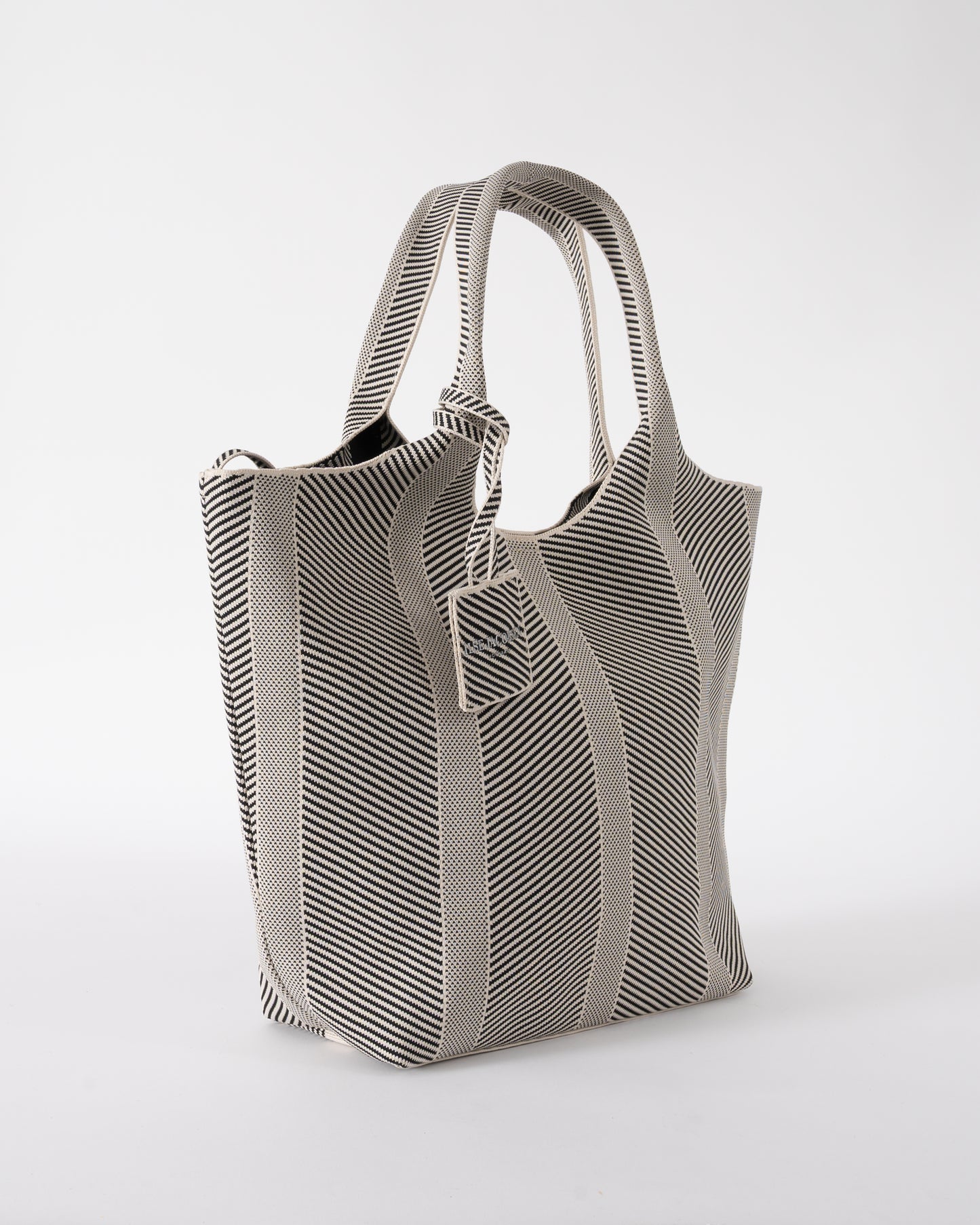 side of Ilse Jacobsen Knitty Womens Knitted Bag in Milk Creme and  Black
