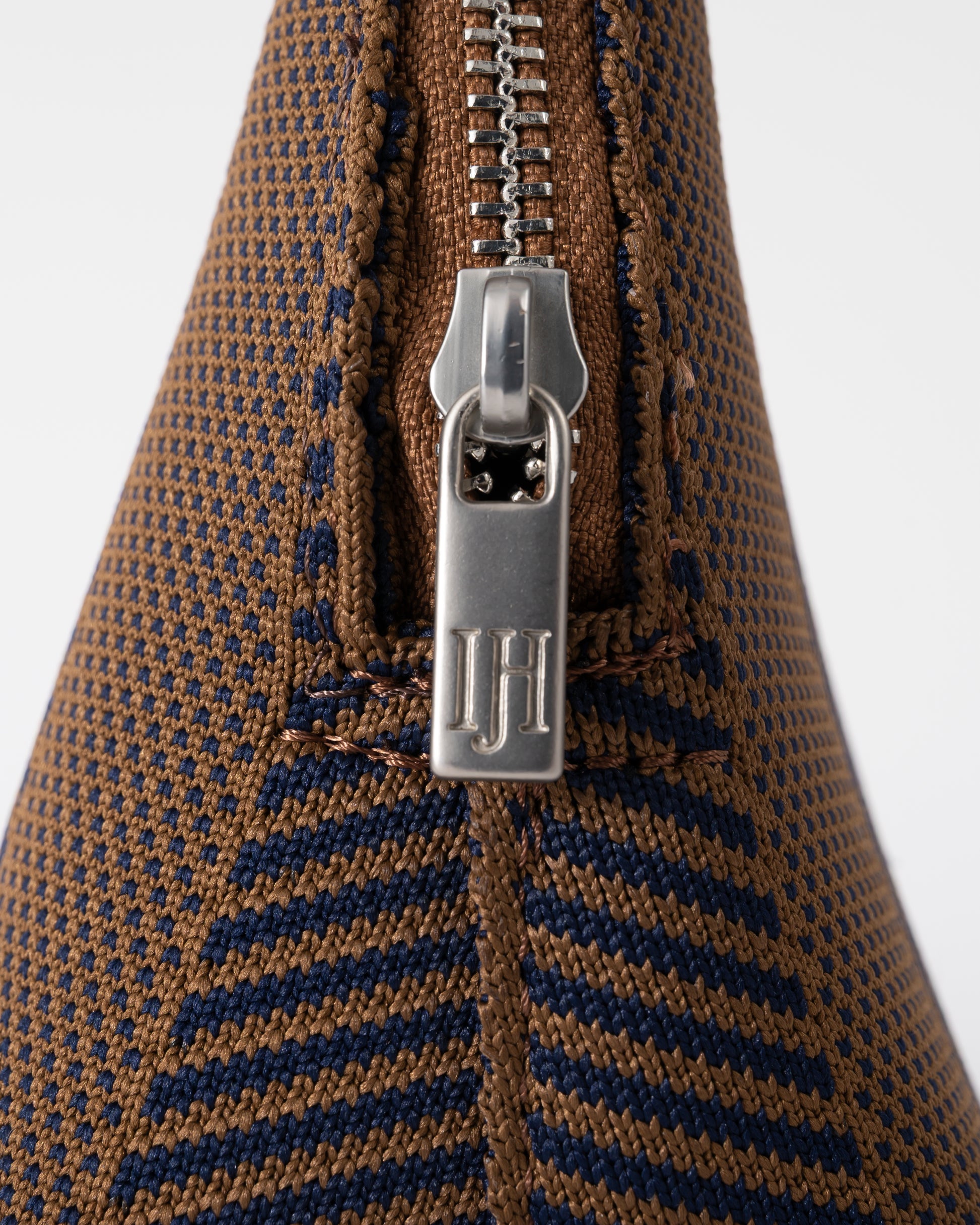 zip detail of of Ilse Jacobsen Knitty Womens Knitted Makeup Bag in Dark Indigo and Buckthorn Brown
