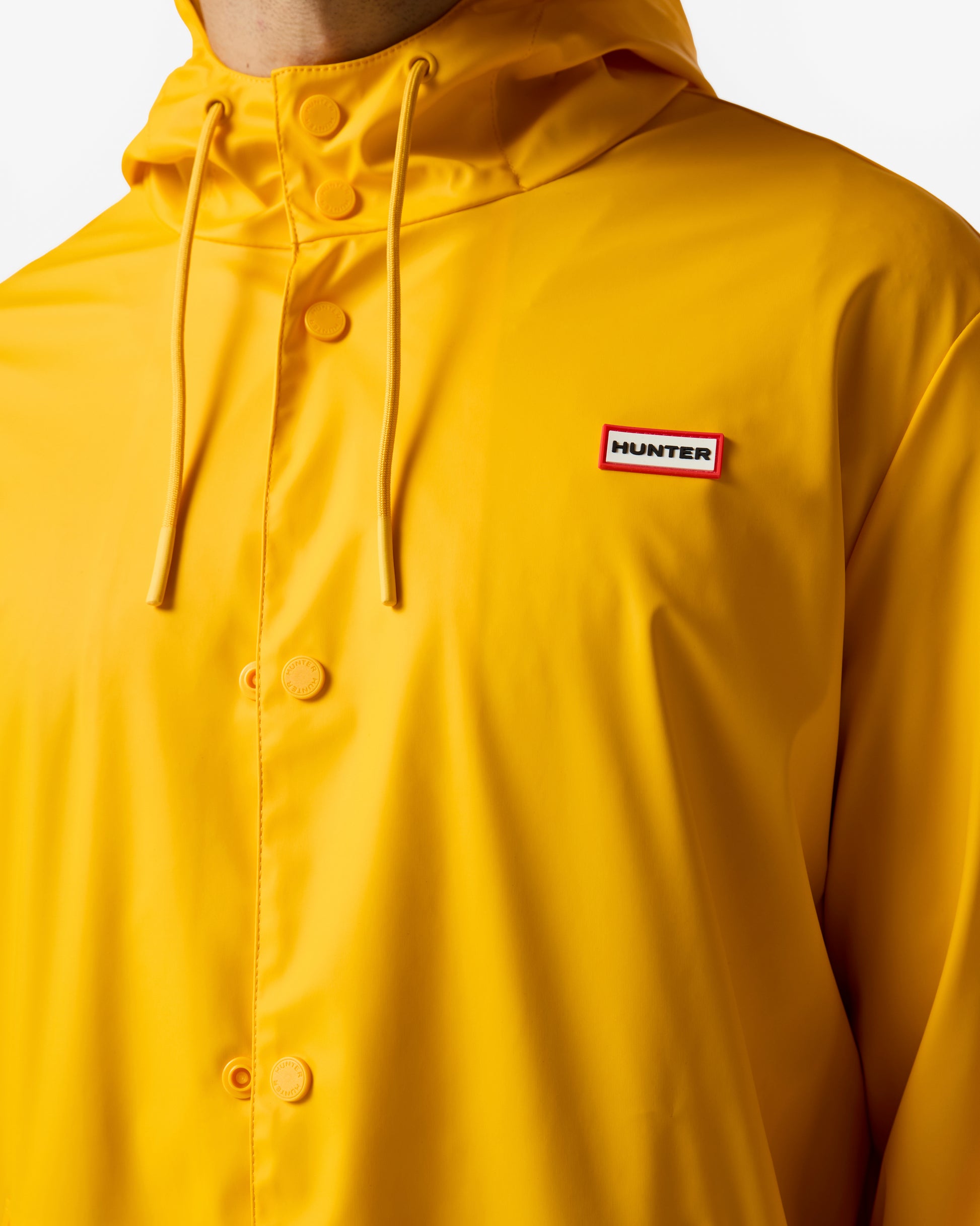 Hunter Jo Unisex Parka in Gold Fusion, male model badge and collar detail