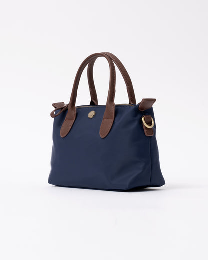 side view of a Joules Edie Womens Mini Crossbody Handbag in Navy