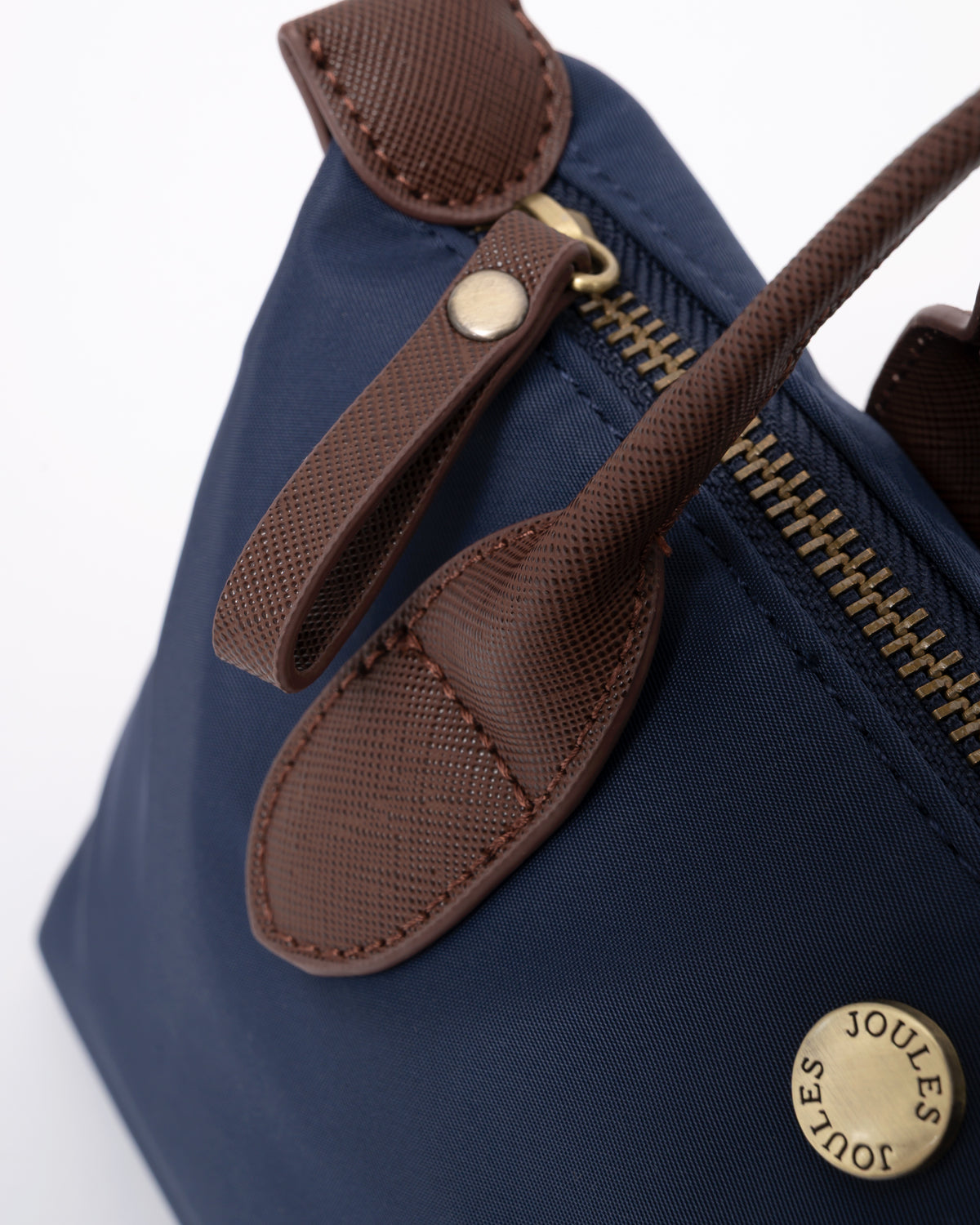 zip pull detail of a Joules Edie Womens Mini Crossbody Handbag in Navy