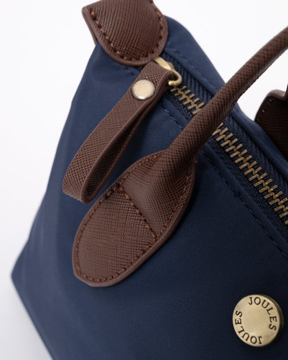 zip pull detail of a Joules Edie Womens Mini Crossbody Handbag in Navy