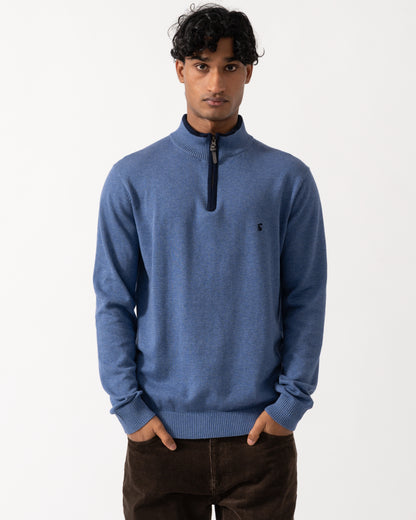 Studio photograph of a model wearing a Joules Hillside Mens 1/4 Zip Jumper in Blue