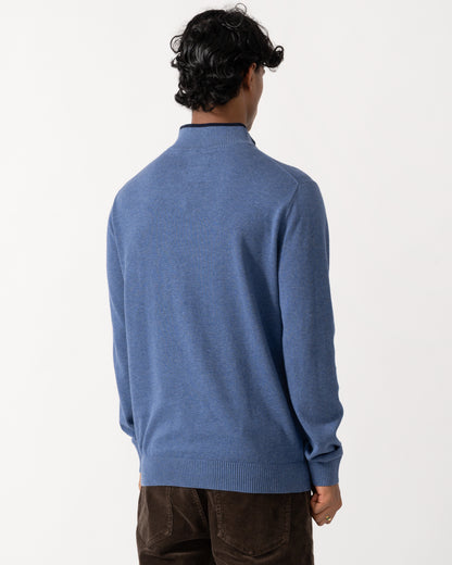 Studio photograph showing the back of a model wearing a Joules Hillside Mens 1/4 Zip Jumper in Blue