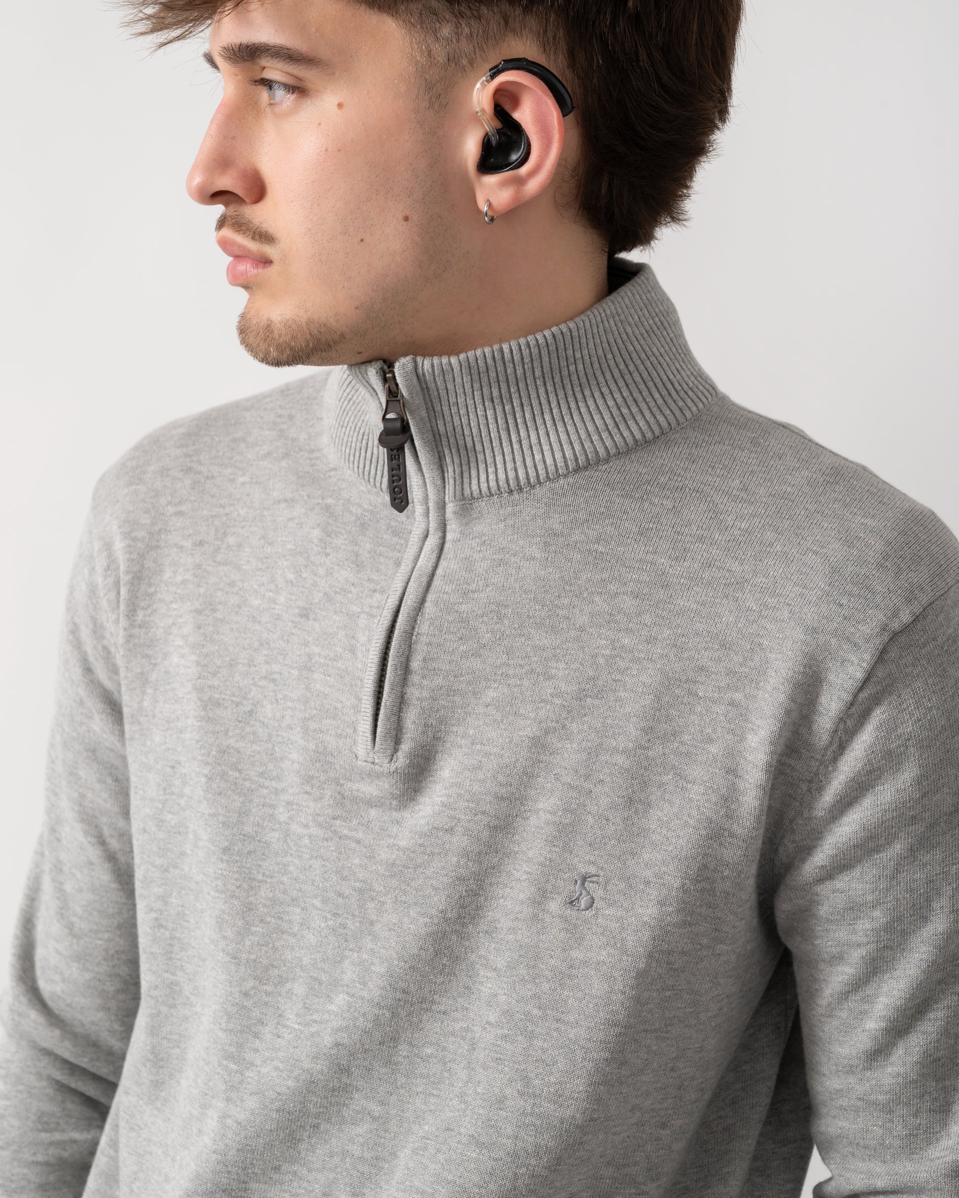close up shot of a model wearing a Joules Hillside Mens quarter Zip Jumper in Grey