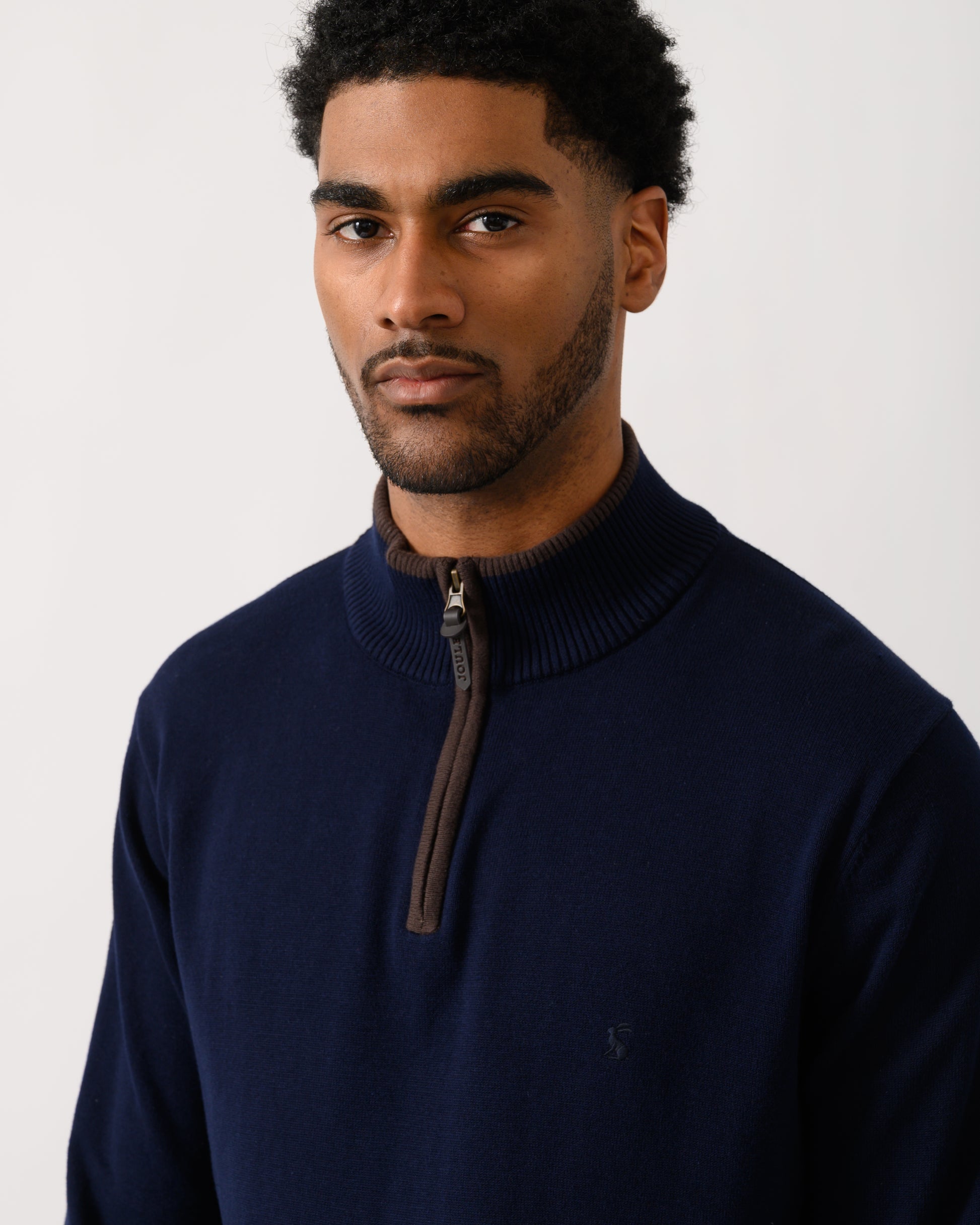 close up shot of a model wearing a Joules Hillside Mens 1/4 Zip Jumper in Navy Blue