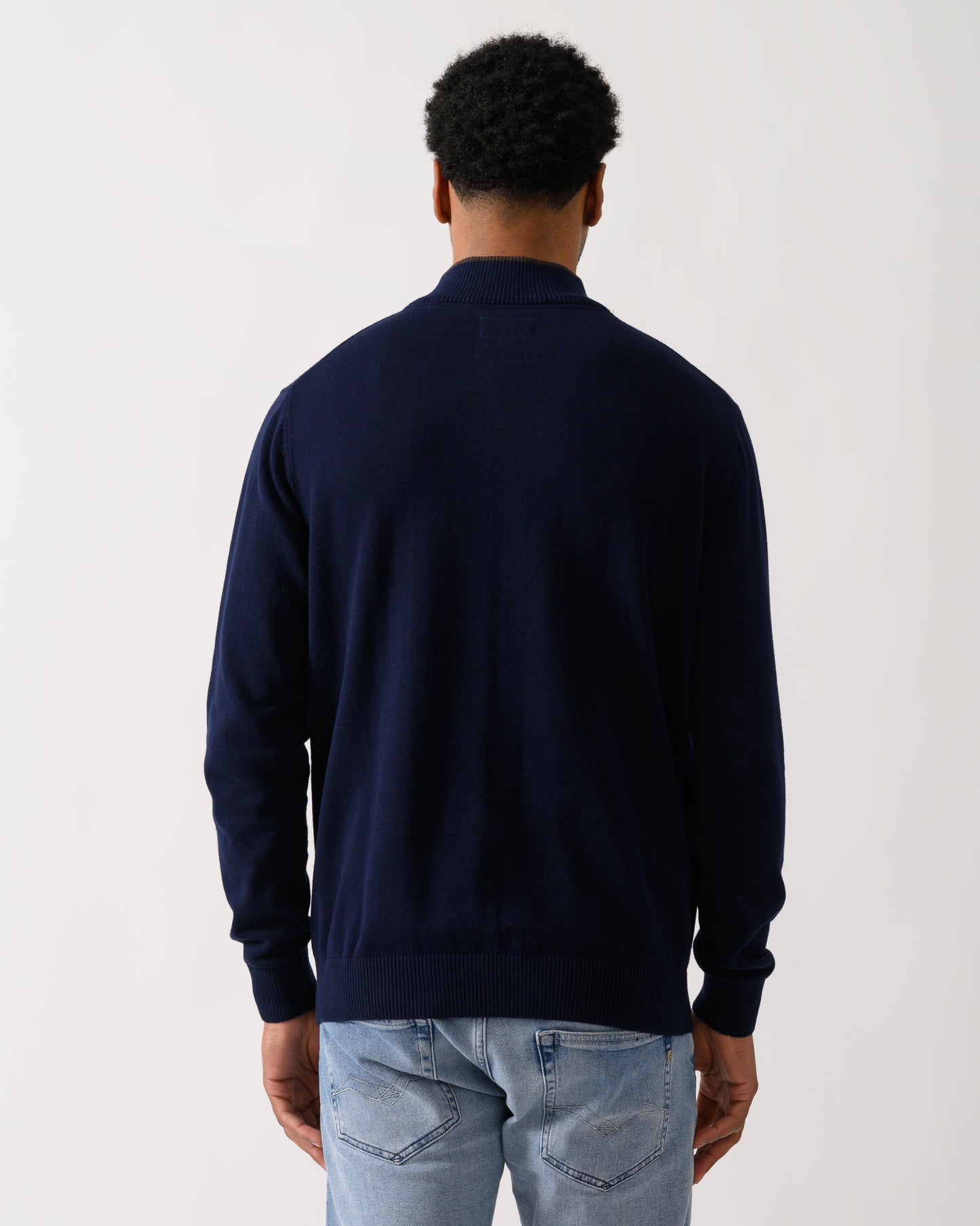 back shot of a model wearing a Joules Hillside Mens 1/4 Zip Jumper in Navy Blue
