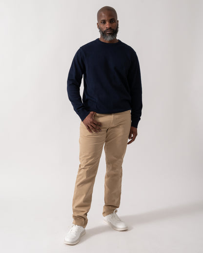 full length shot of a Model wearing a Joules Hillside Mens Crew Neck Jumper in Navy Blue