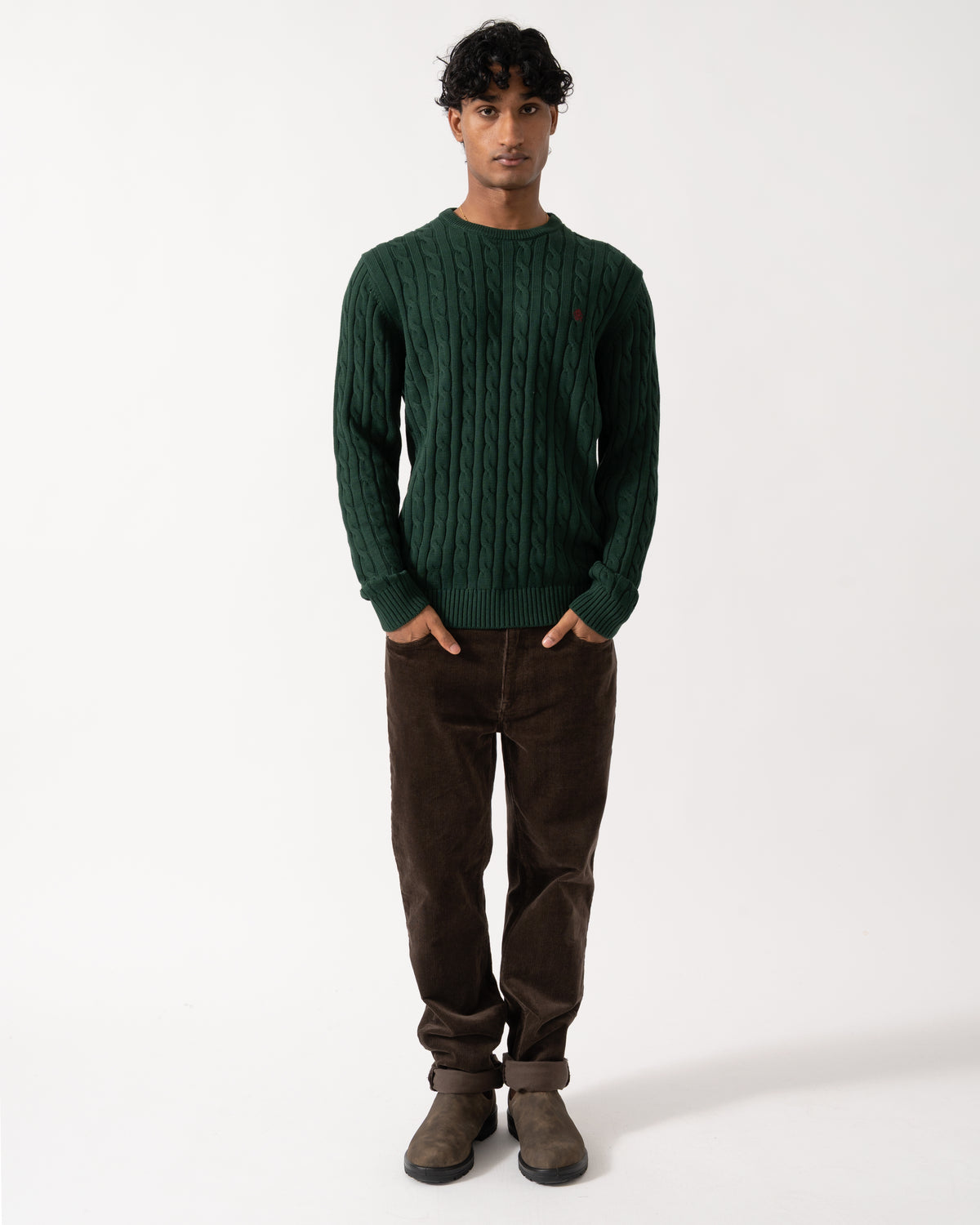 full length Studio photograph of a model wearing a Joules Mens Cable Knit Crew Neck Jumper in Green