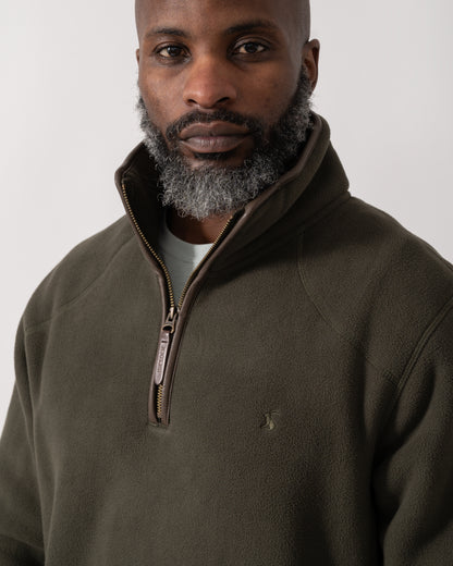 close up shot of a model wearing a Joules Mens Heritage 1/4 Zip Fleece in Dark Green
