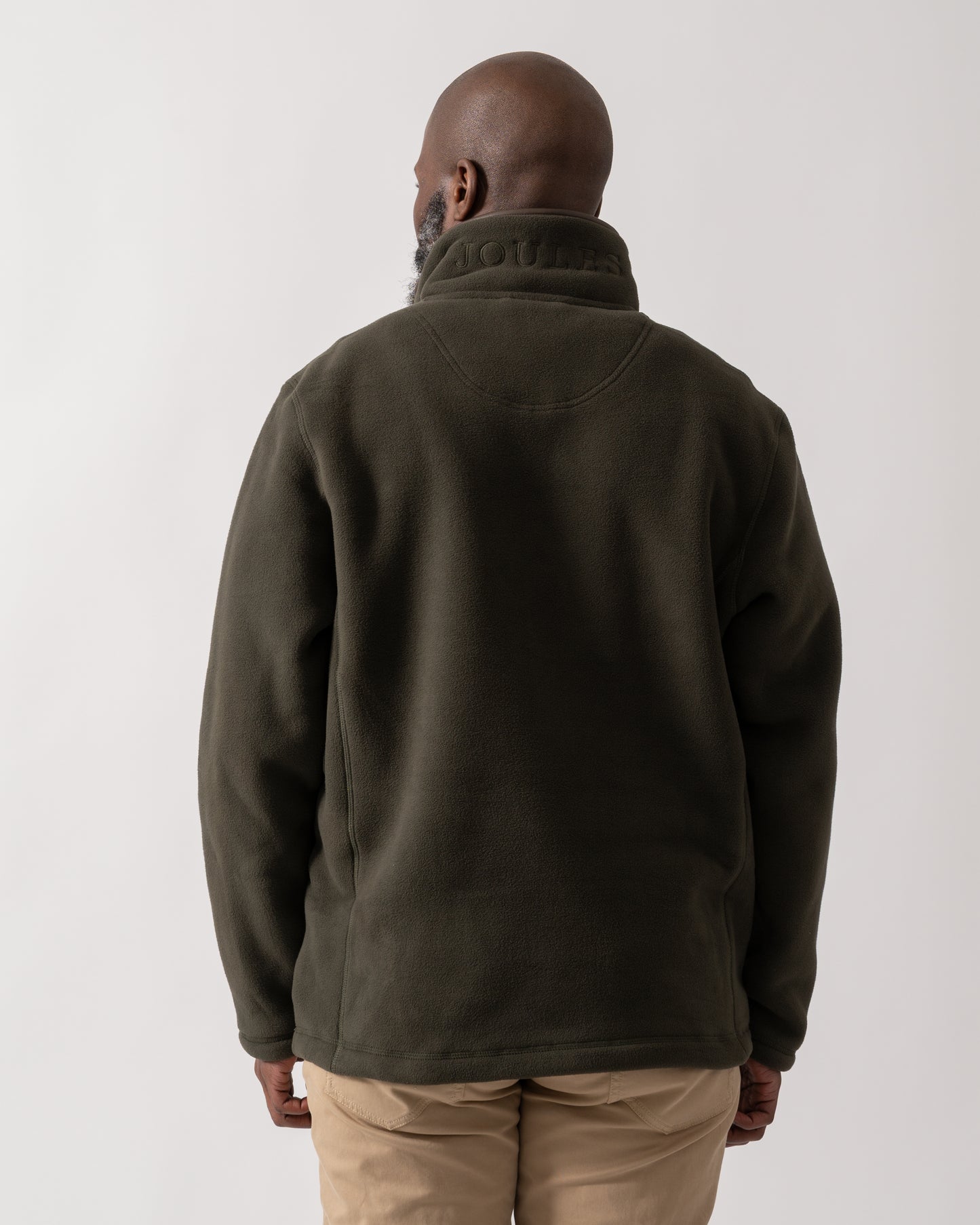 back shot of a model wearing a Joules Mens Heritage 1/4 Zip Fleece in Dark Green