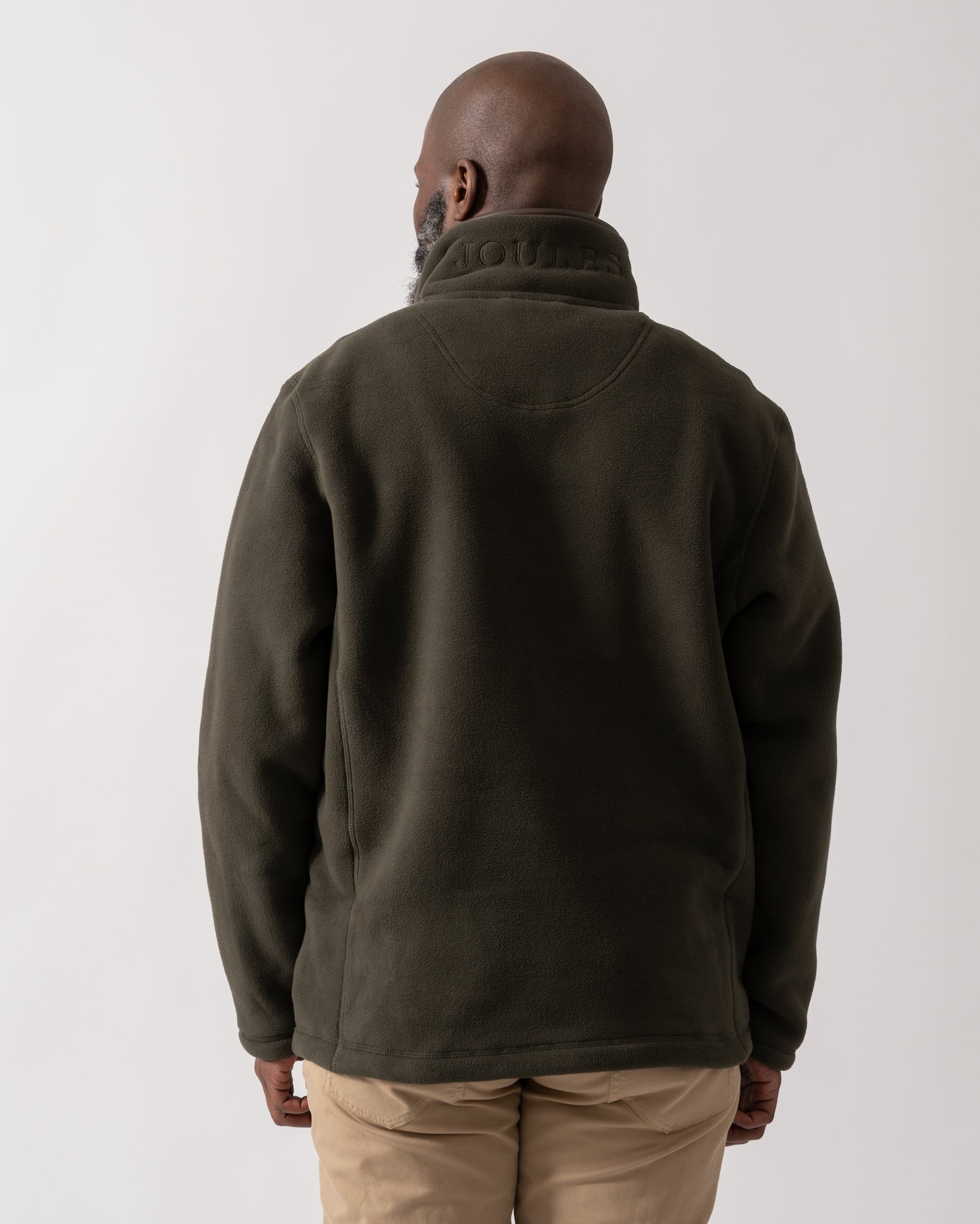 back shot of a model wearing a Joules Mens Heritage 1/4 Zip Fleece in Dark Green