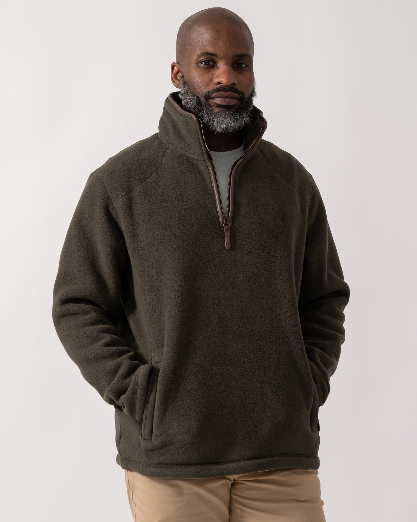 model wearing a Joules Mens Heritage 1/4 Zip Fleece in Dark Green